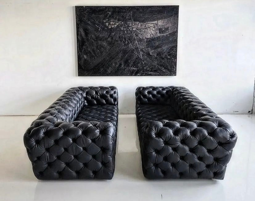 Deep button chesterfield couches in Italian Leather