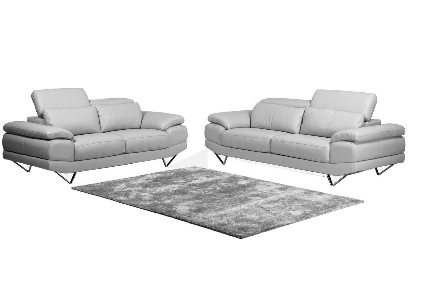 2 and 3 seater sofas in full light grey leather , with adjustable headrests.