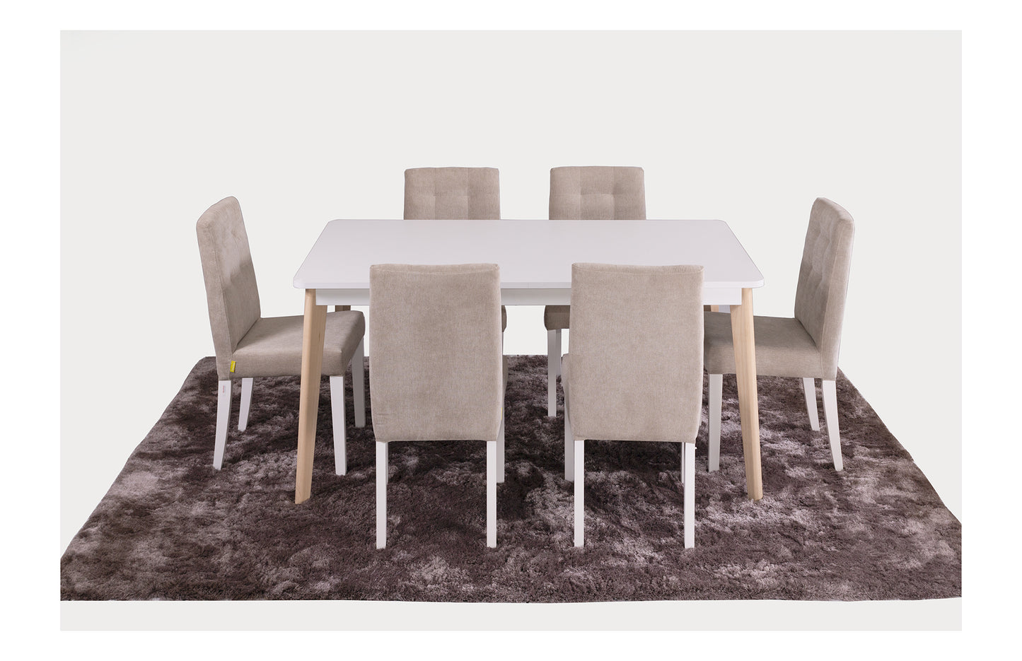 The Faro 6 seater dining table in white and oak wood finish. this dining room set includes 6 dining chairs upholstered in a luxury beige fabric.