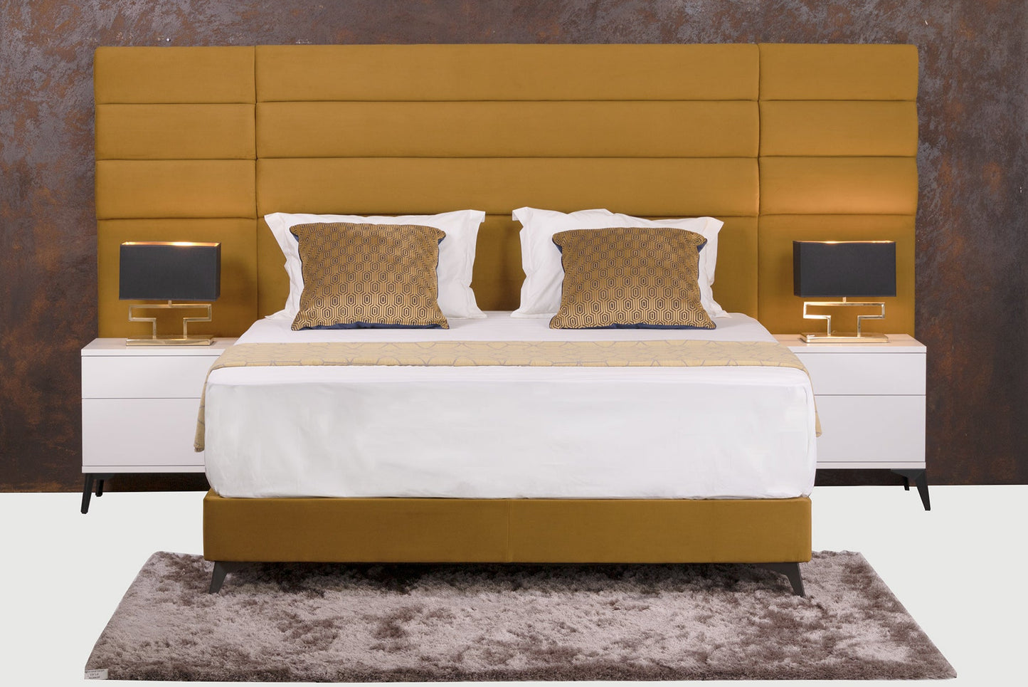 Jones sleigh bed upholstered in luxury yellow fabric, with extra width headboard. Headboard height is adjustable.