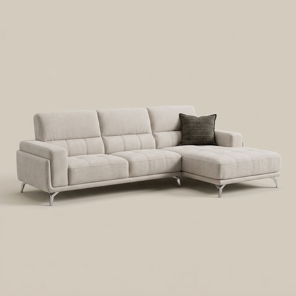 Light grey textured luxury fabric L-shape sofa with fold-over arms and chrome feet. GALERIA FURNITURE SOUTH AFRICA.