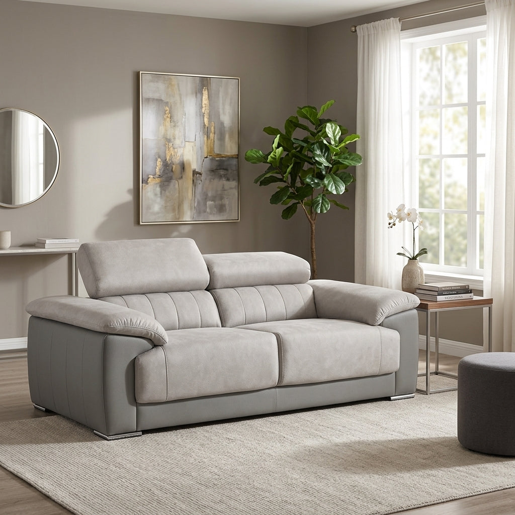Light grey 2 seater sofa+ adjustable headrests + chrome feet. Euro Crafted couches. Galeria Furniture in south africa.