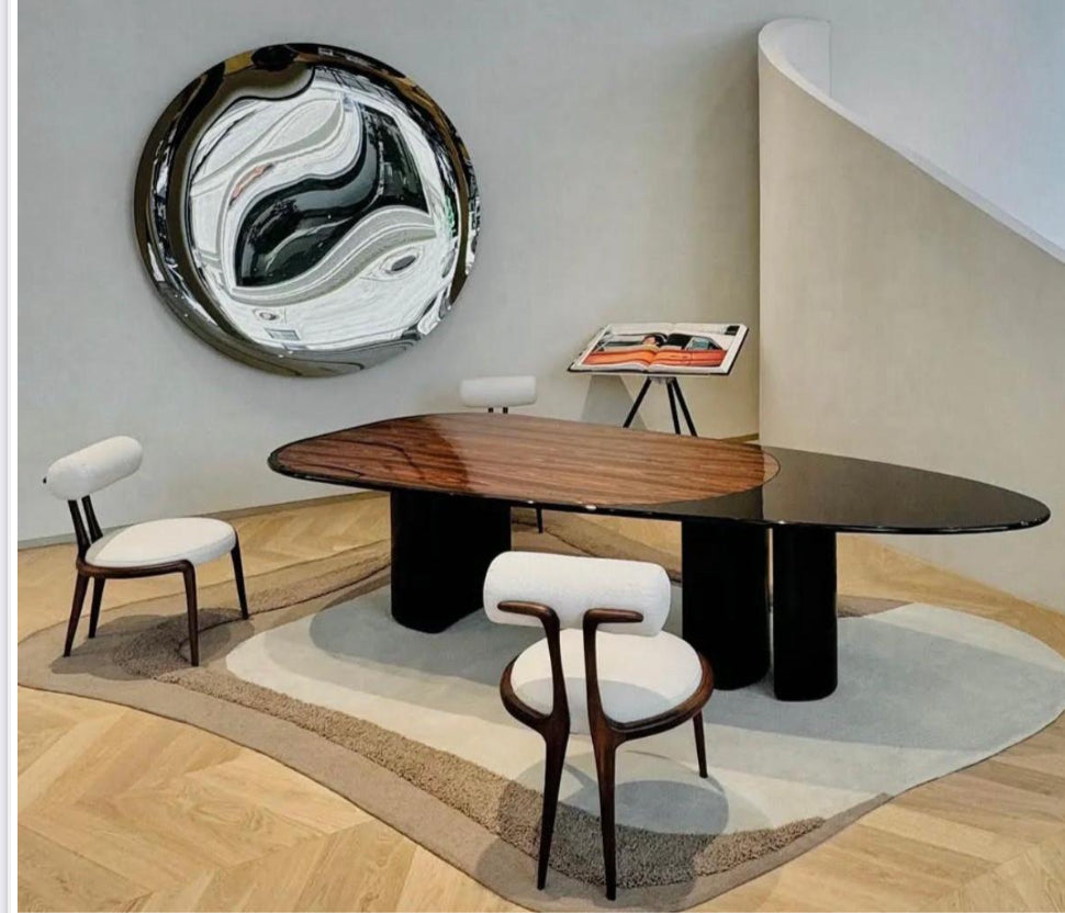 Glossy white dining table with 3 legs