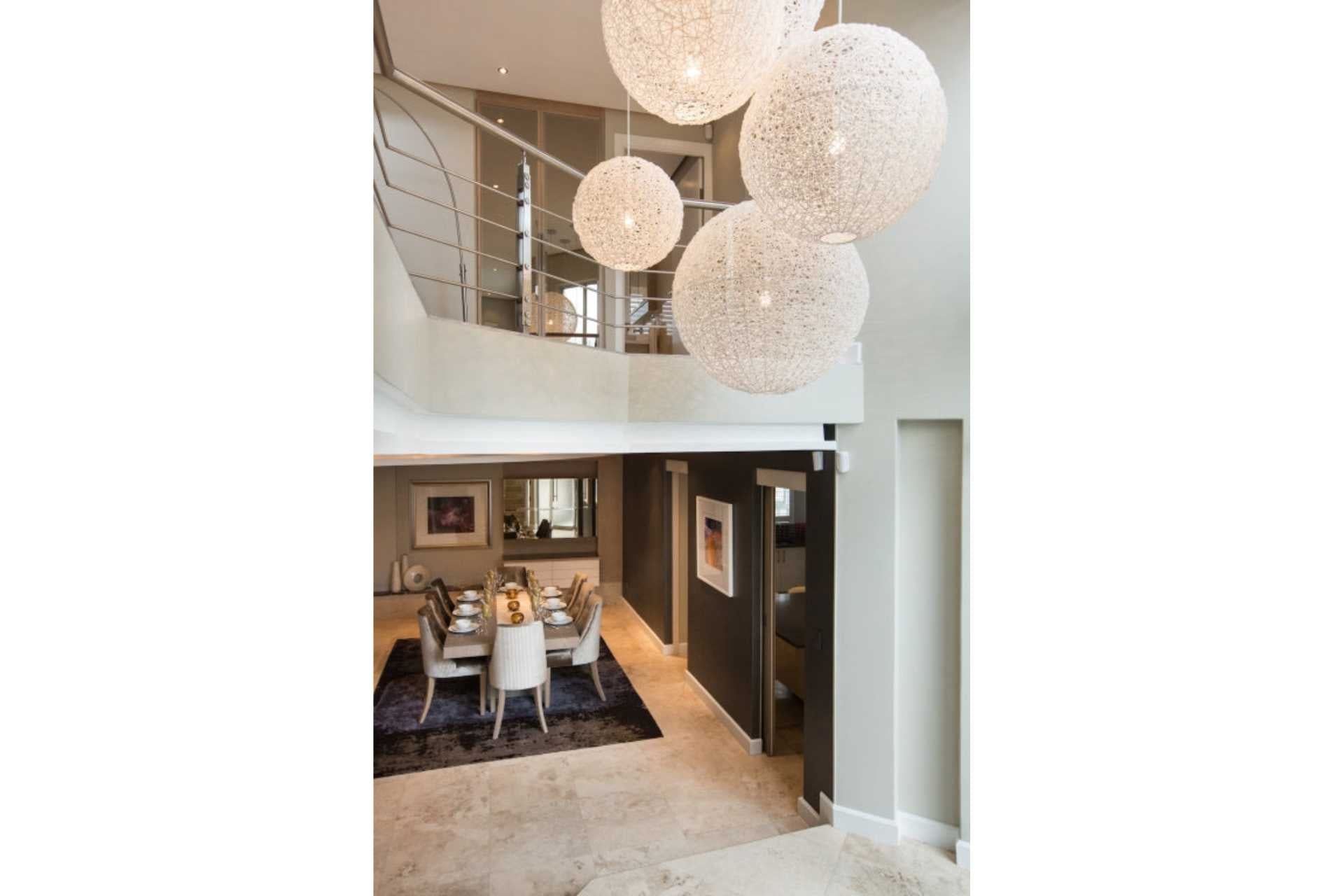 These pendant lights are made from Handwoven white resin balls