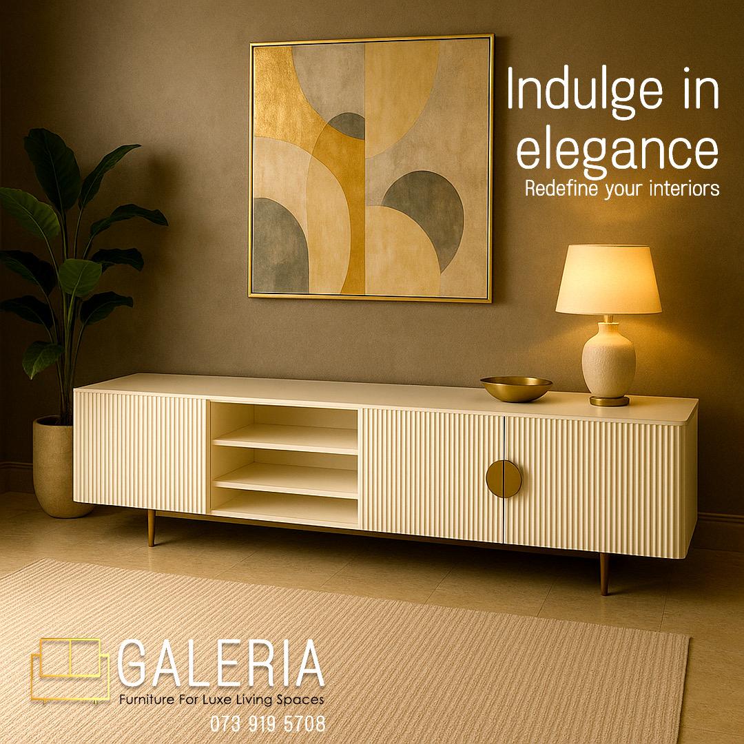 white wooden tv stand with gold steel accent handles and channel design