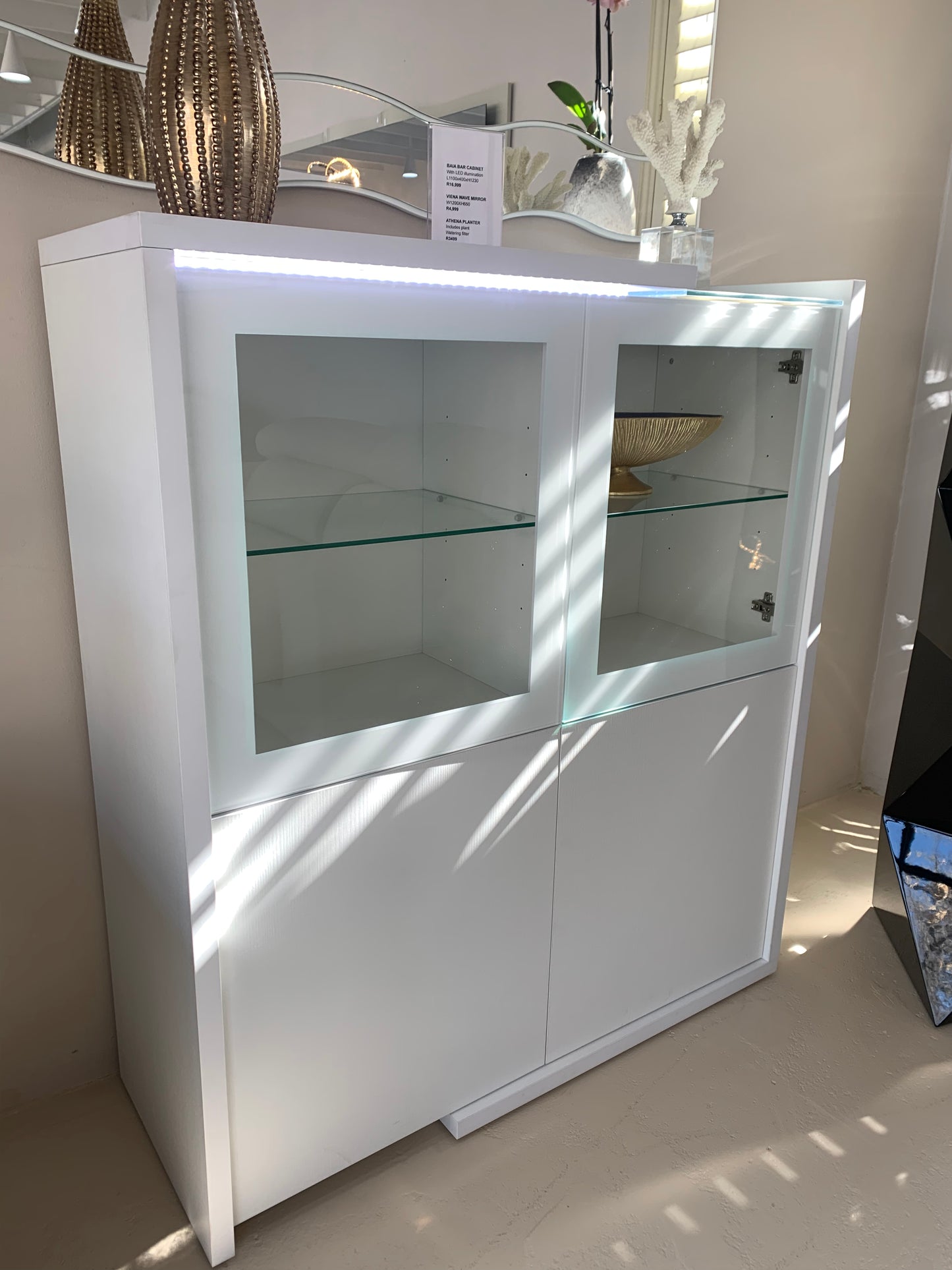 White wood 4 door cabinet with glass shelves and LED illumination