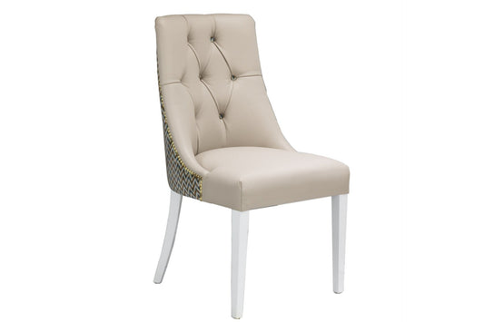 deep button dining chair with beige leather front and fabric back.