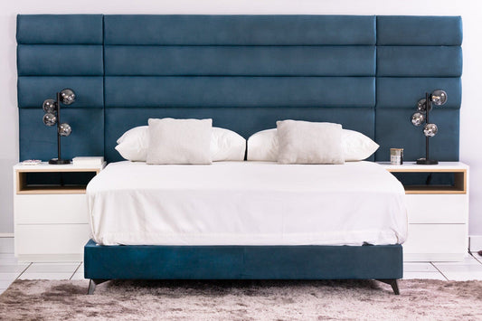 european made sleigh bed, upholstered in luxury fabrics with channel design