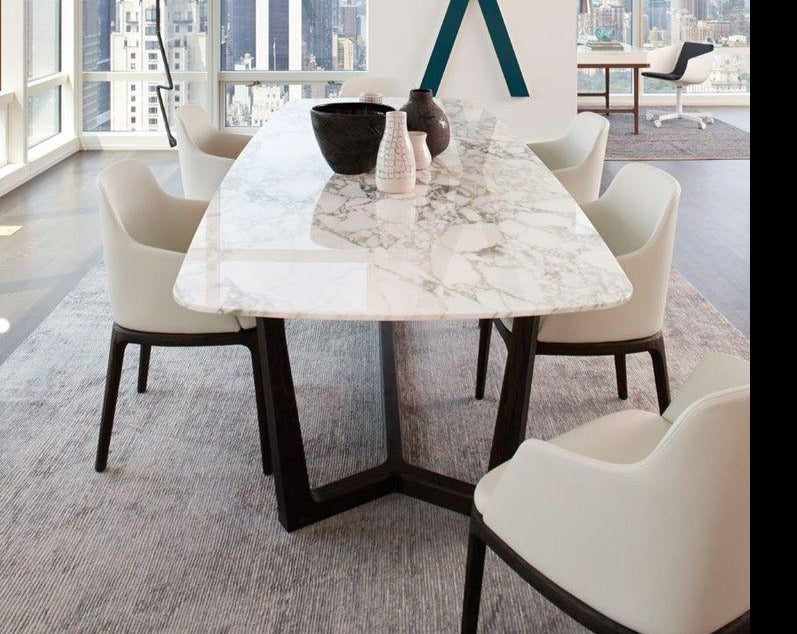 Stone top dining table with steel legs. These dining tables are customizable in different stones and steel or wood legs.