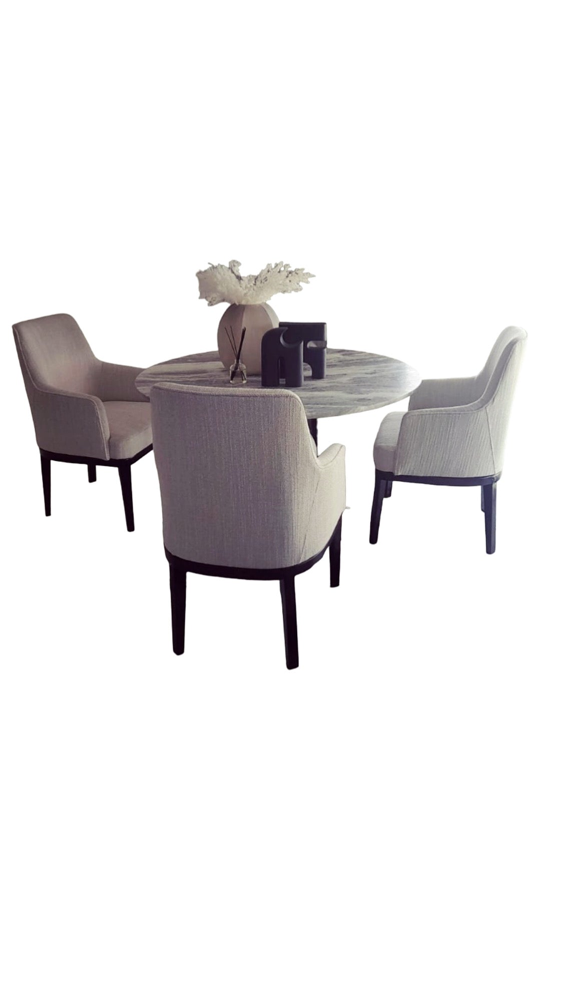 Georgina dining chairs upholstered in fabric with dark wood frame and legs