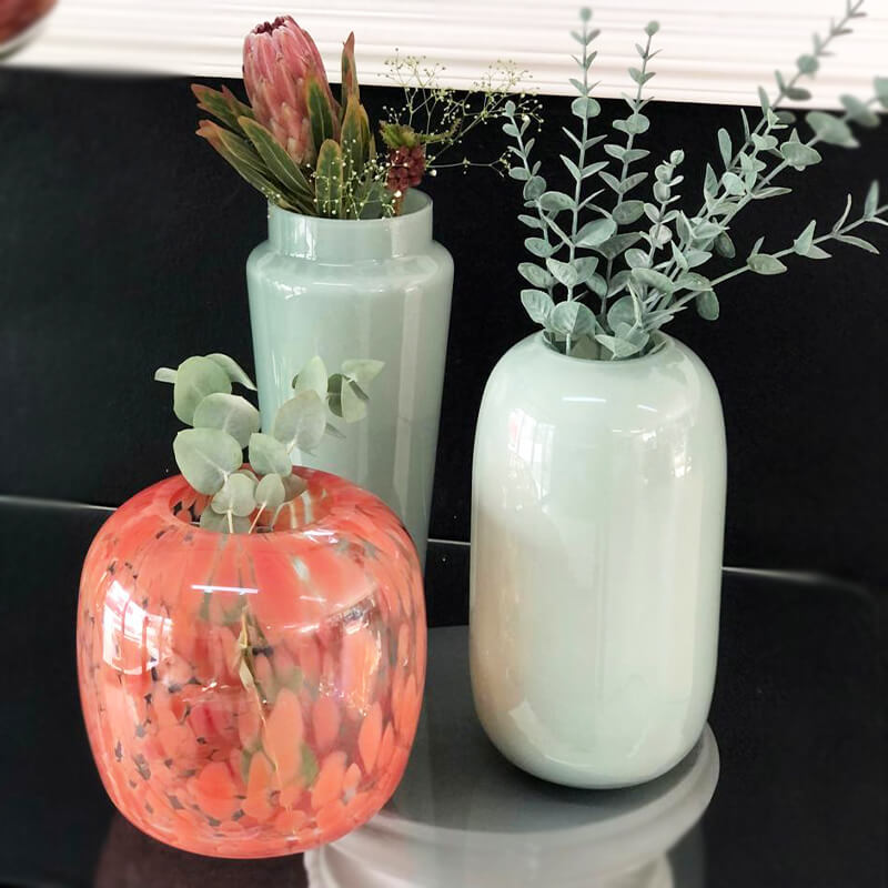 coral and sage green capsule vases. 