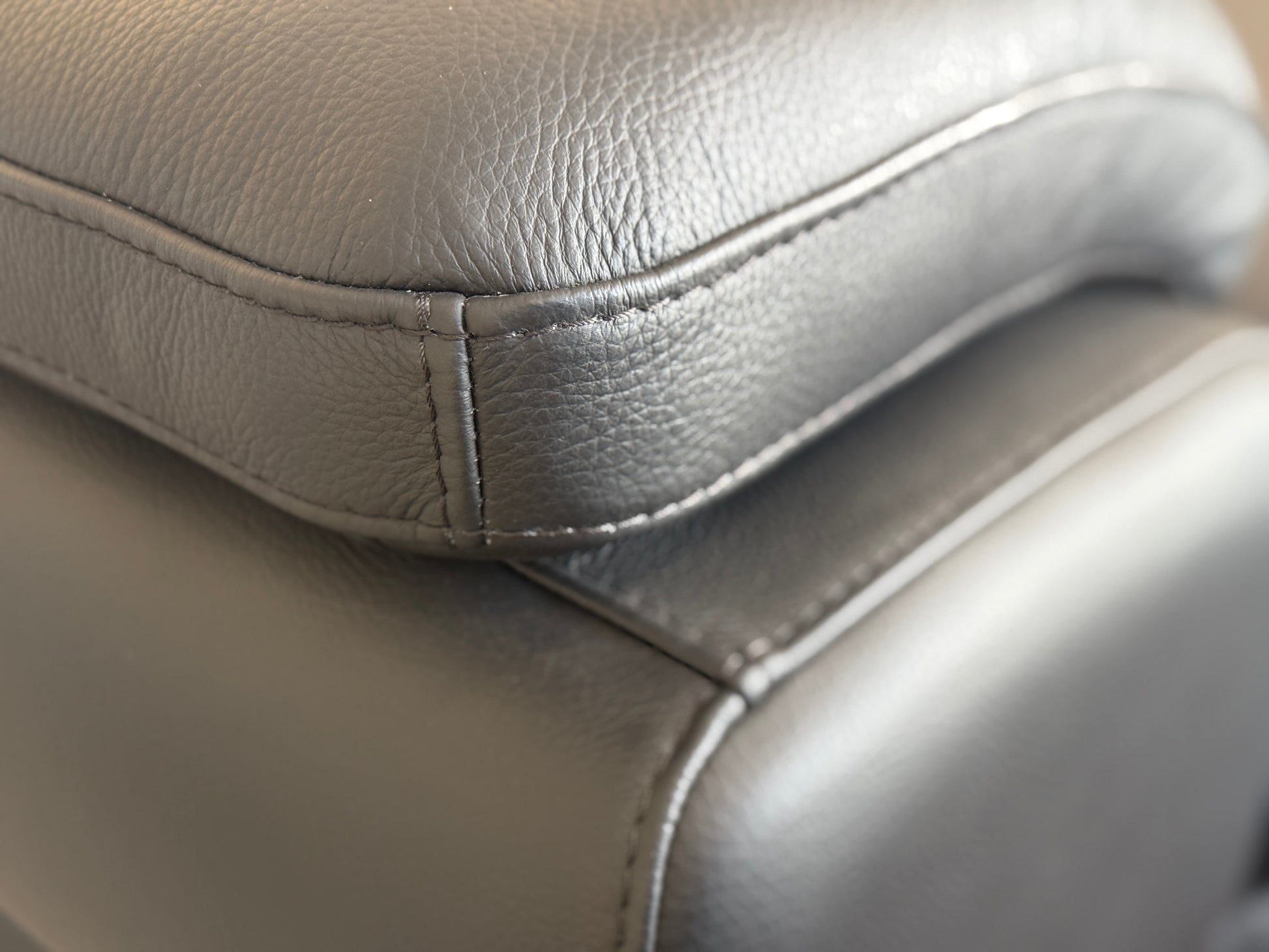 Close-up of black leather on the Dennis corner couch. Galeria fFurniture SA