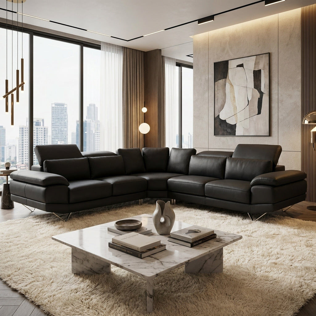 A black leather 6 seater corner couch with adjustable headrests.