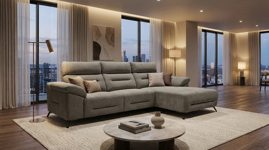 luxury corner couch in soft grey fabric and with storage arms.