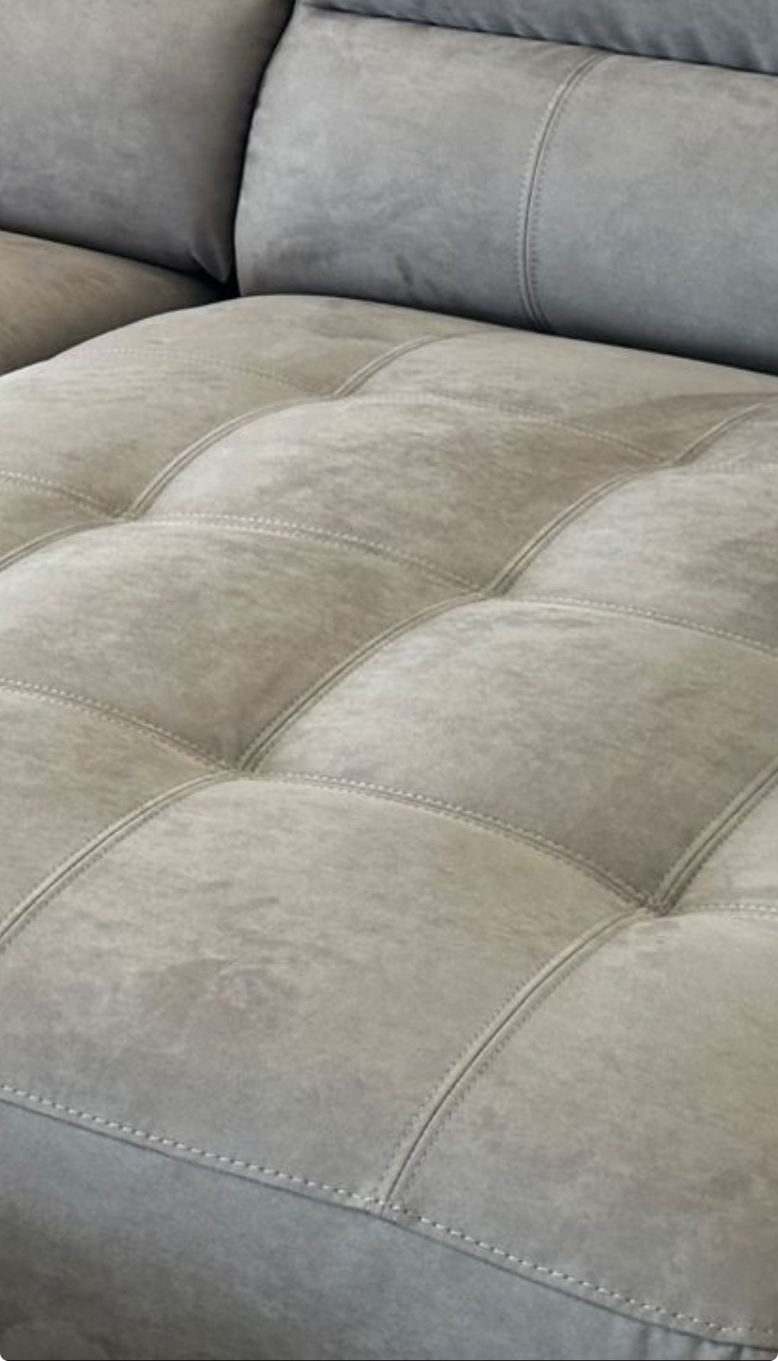 Fabric colour and texture and stitching detail close-up of the Megan sofa.