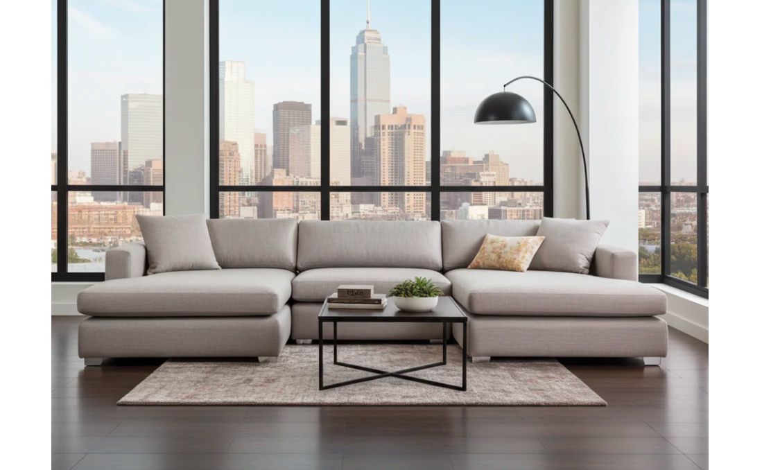 Large sectional couch in grey easy clean fabric. 