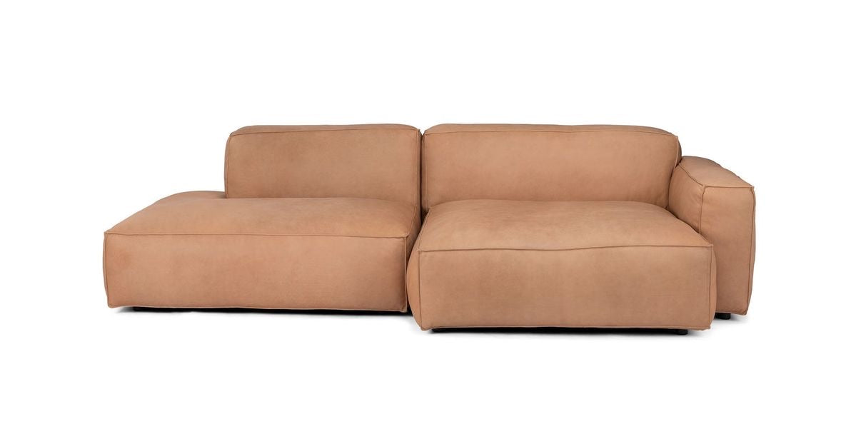 Sectional sofa pieces in leather with arm rests.