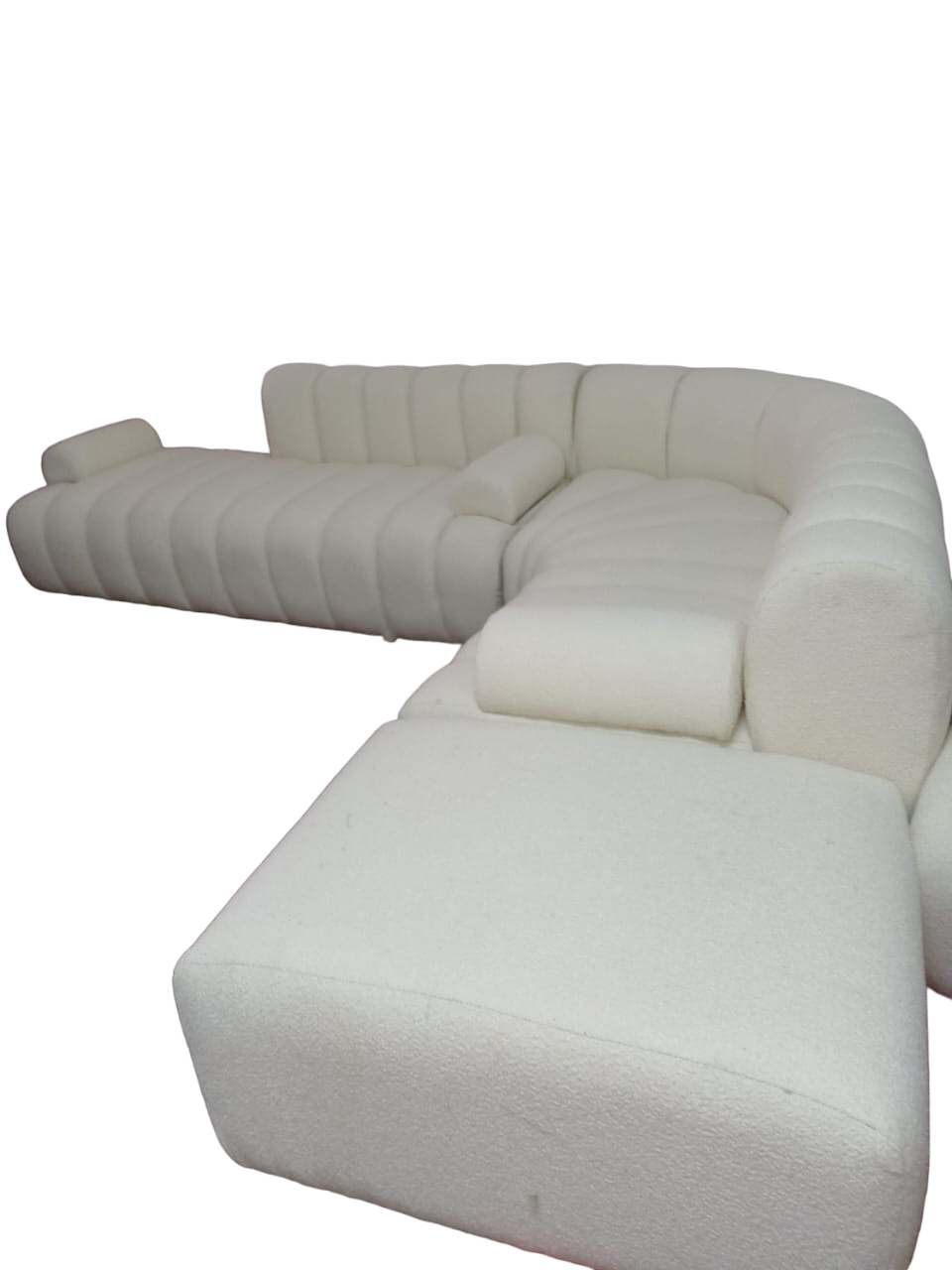 Boucle fabric corner couch with segment detail and armrests. Modular fabric couch.
