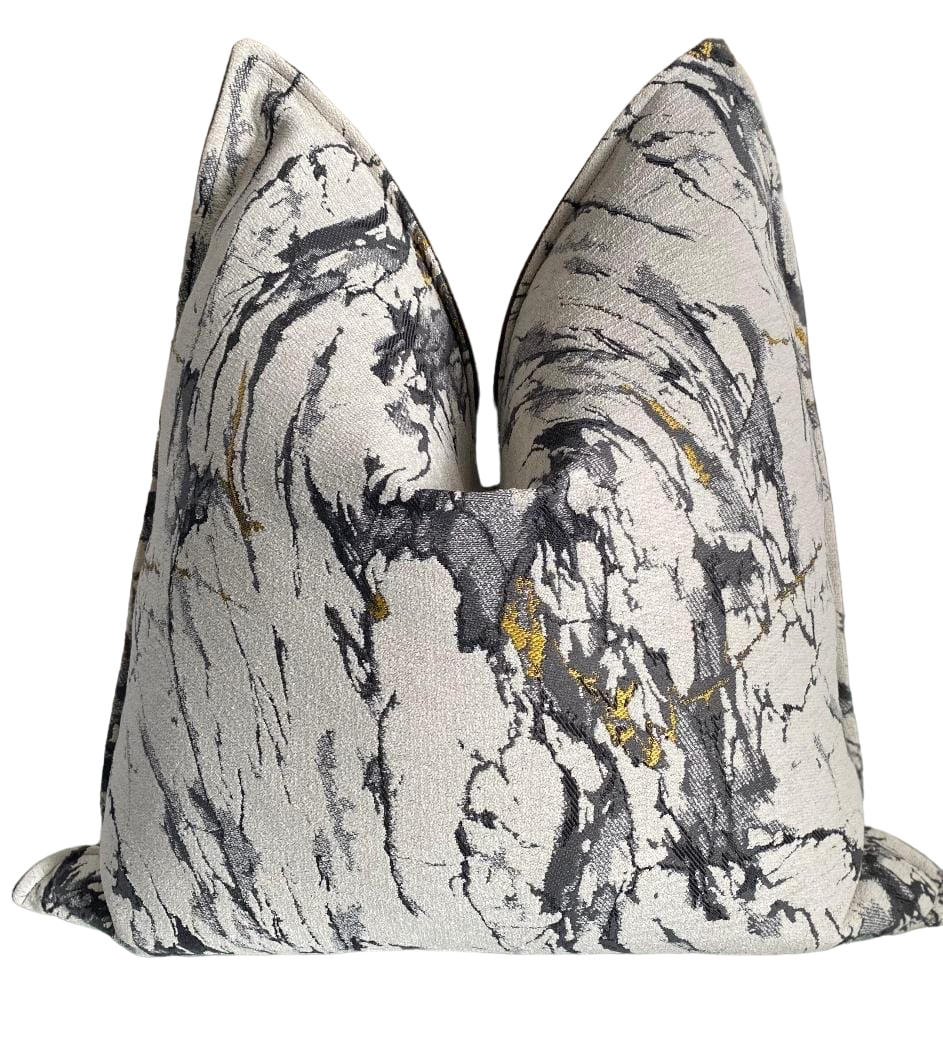 large scatter cushion in textured off white fabric with shades of grey and yellow.