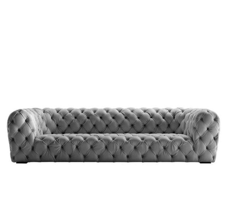 Grey leather Chesterfield couch