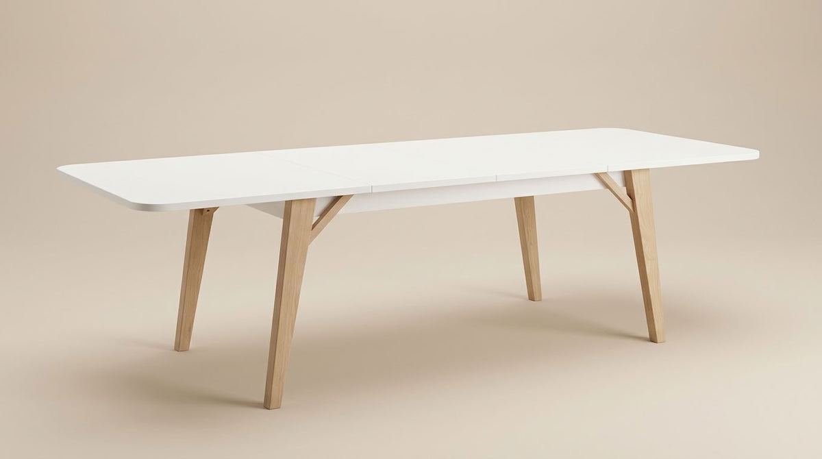 Sleek Nordic style extendable dining table in white wood and light wood legs. GALERIA FURNITURE SA