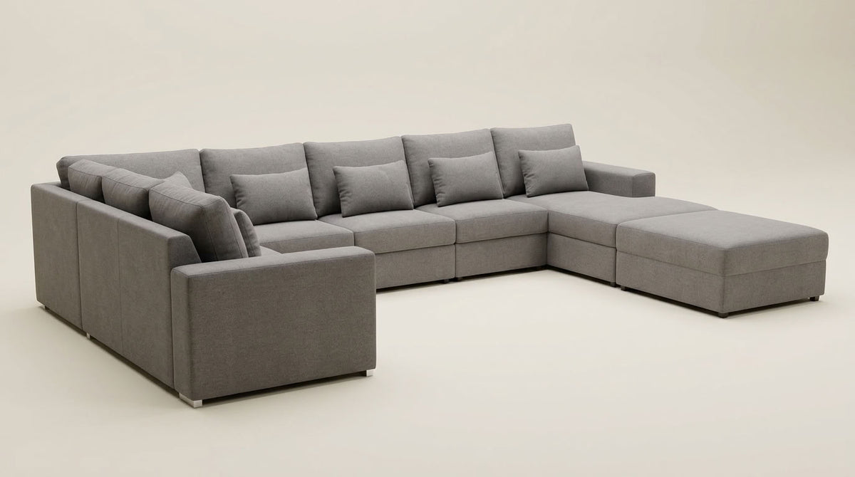 Large family sized grey corner couch with daybed and movable ottoman. Includes scatters. Euro Crafted. Superior comfort. GALERIA FURNITURE SA
