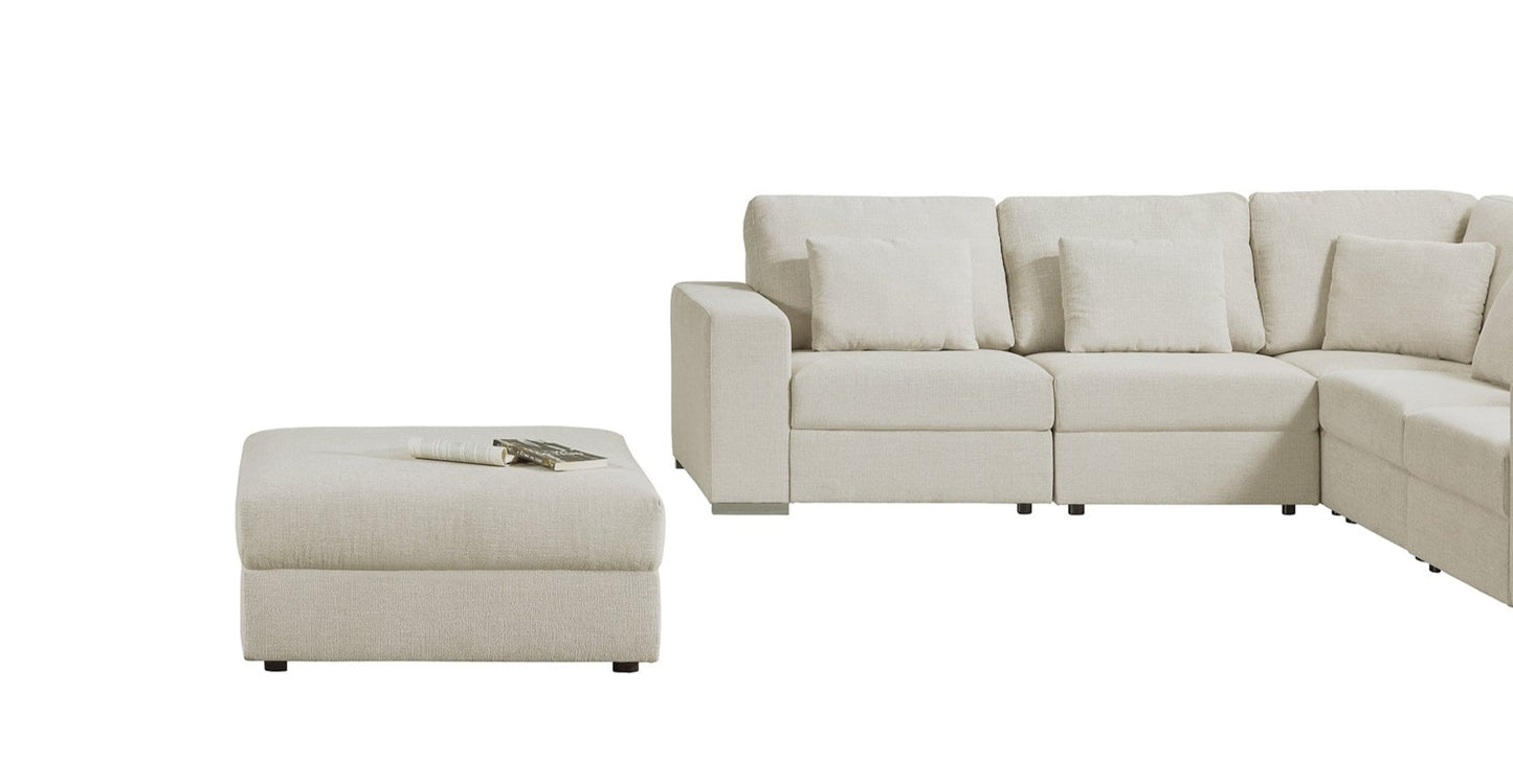 Modular fabric corner couch with movable ottoman that creates a daybed or can be used as a coffee table