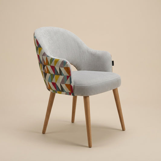  dining chair with gemoetric patterned fabric on backrest and softly textured light grey fabric front. Galeria Furniture SA