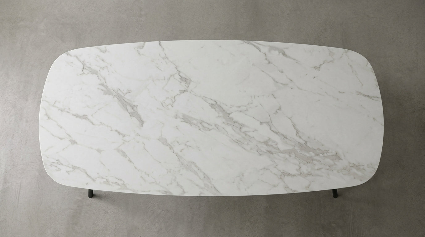 Top-down view of the Malmo dining table's light white and grey marble-effect melamine top. GALERIA FURNITURE SA