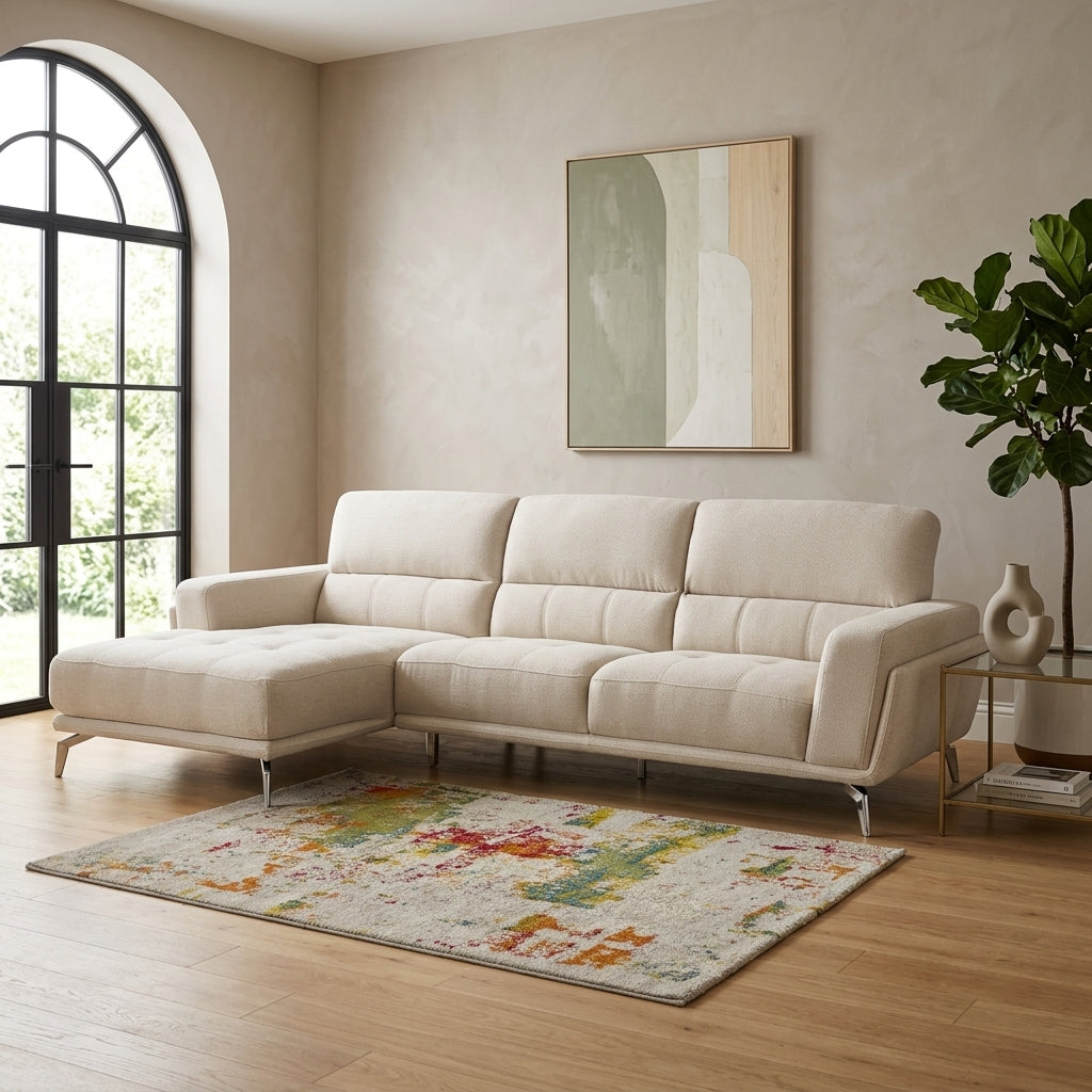 Cream L-shape couch with high backs. Galeria Furniture SA