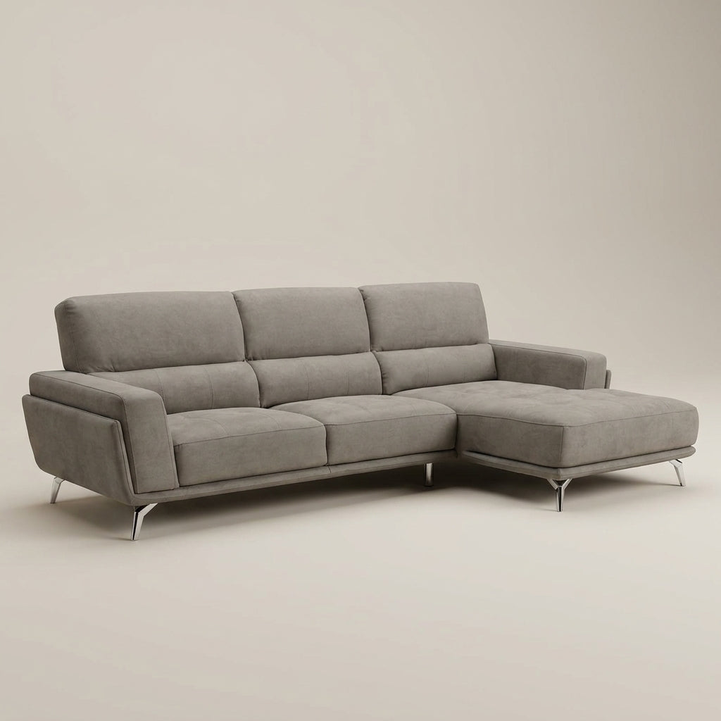 A designer corner couch in elephant grey fabric. This L-shape sofa is made in Europe and sold exclusively at Galeria Furniture. 