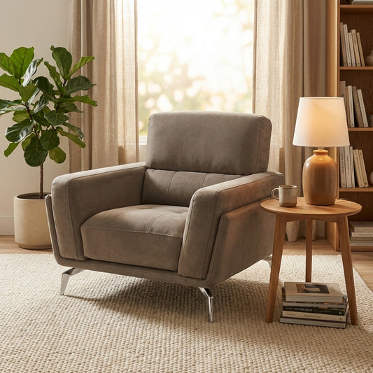 Modern fabric armchair in elephant grey fabric and with chrome silver feet.