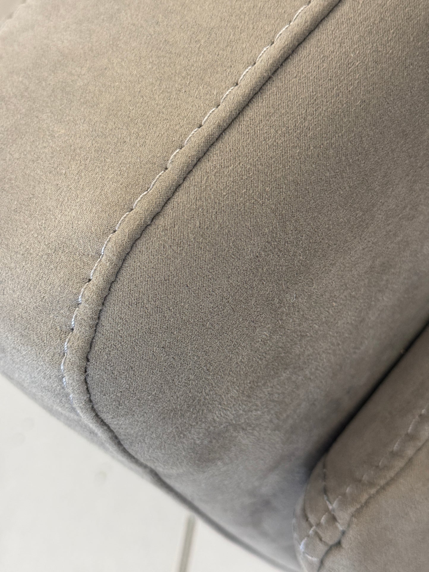 Close-up of a gray fabric colour with stitching details
