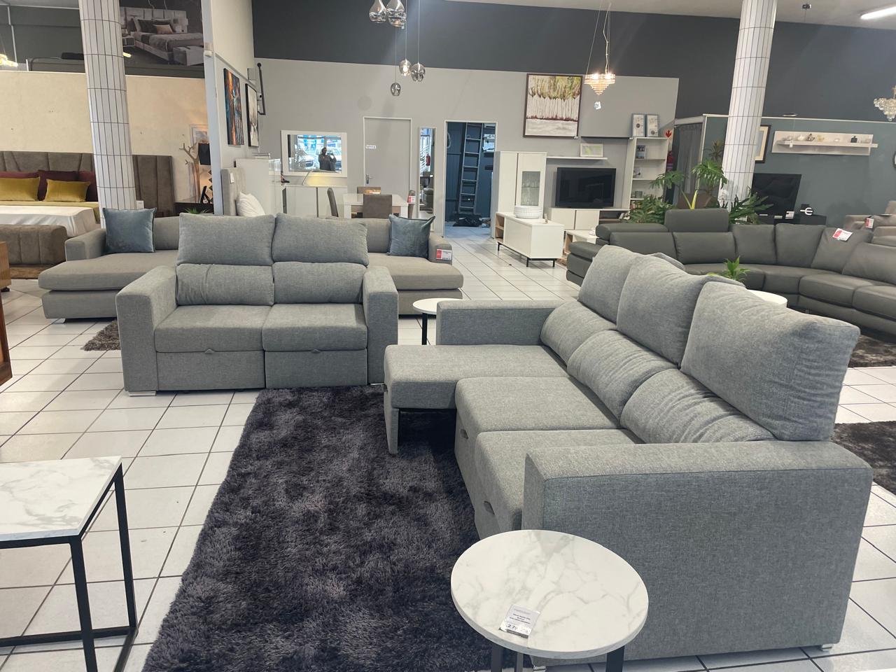 Grey fabric sofa set with pull out leg mechanism. Galeria Furniture Mbombela. Shipping nationwide.