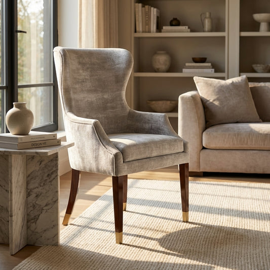 luxury dining chair in silver luxe fabric and mahogany legs with gold tips
