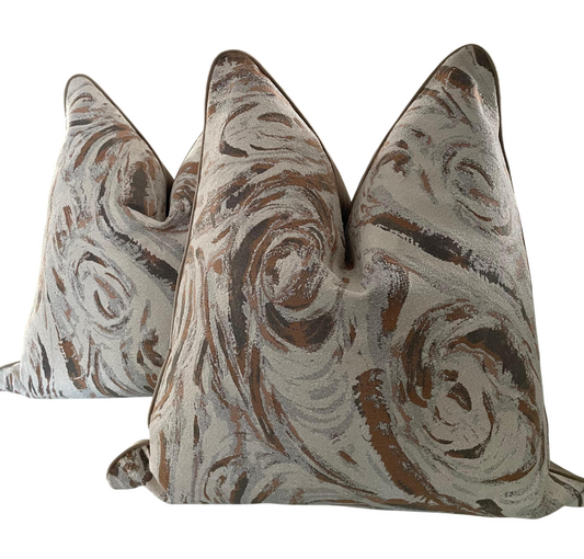 60x60 size scatter cushion in caramel silver and off white colour swirls.