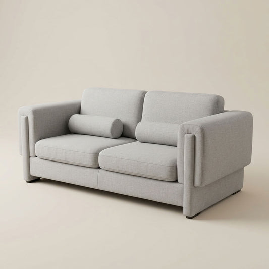Light grey , luxury fabric 2 seater designer couch with fold over arms. GALERIA FURNITURE SOUTH AFRICA.