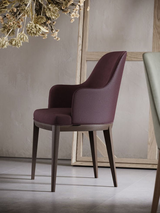 Custom made dining chair with arms and dark wood legs, can be made in italian leather or hertex fabric. 