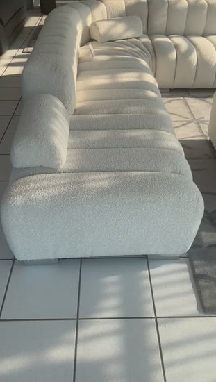 Large corner couch in a segment channel design and with optional daybed and loose ottoman.with optional 