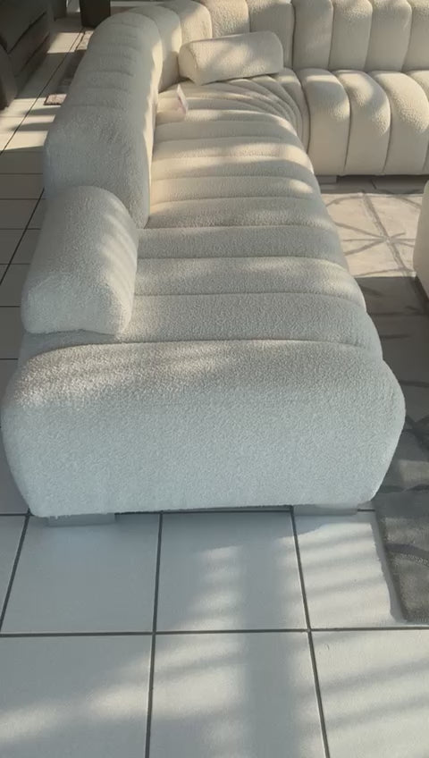 Large corner couch in a segment channel design and with optional daybed and loose ottoman.with optional 