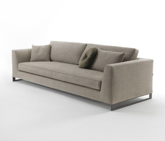 Fabric sofa that can also be made in leather, this sofa has back cushioning and steel frame legs.