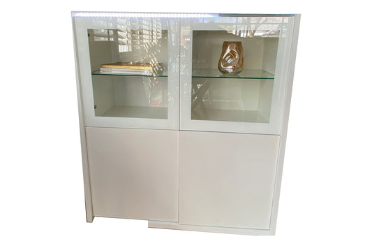 White wood bar cabinet with glass doors and LED illumination