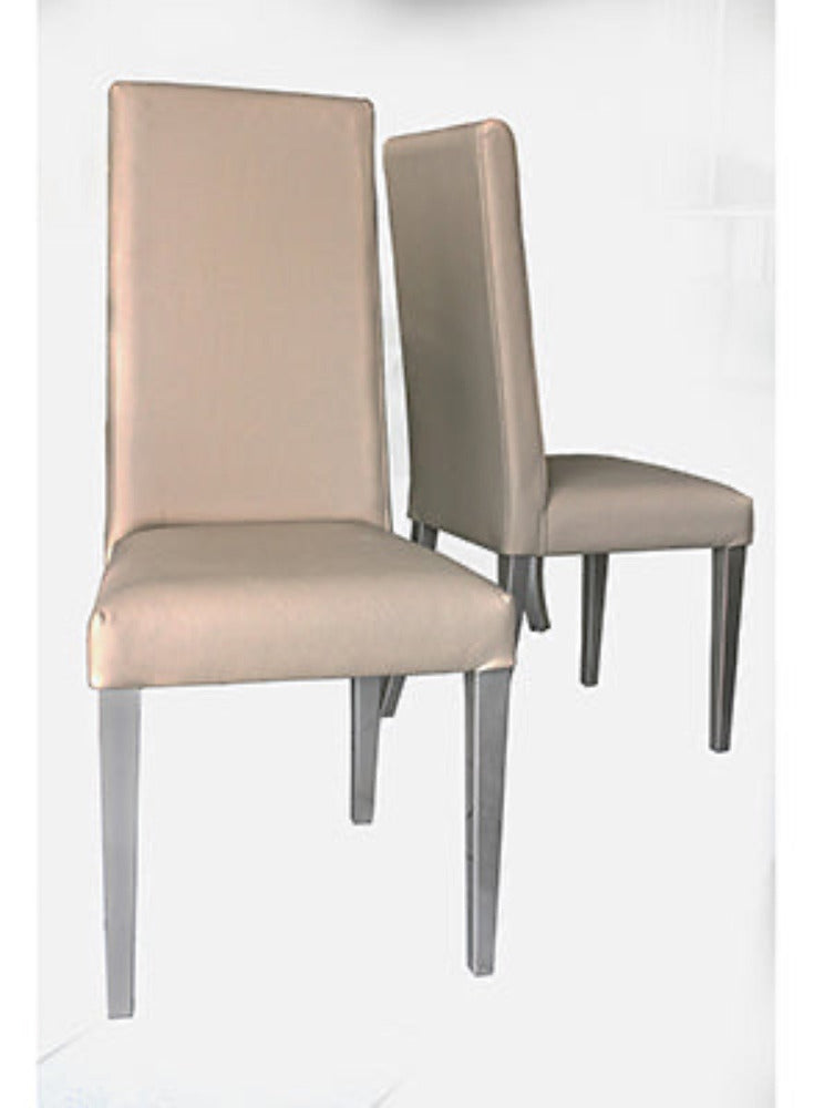 Tan leather dining chair with silver legs.