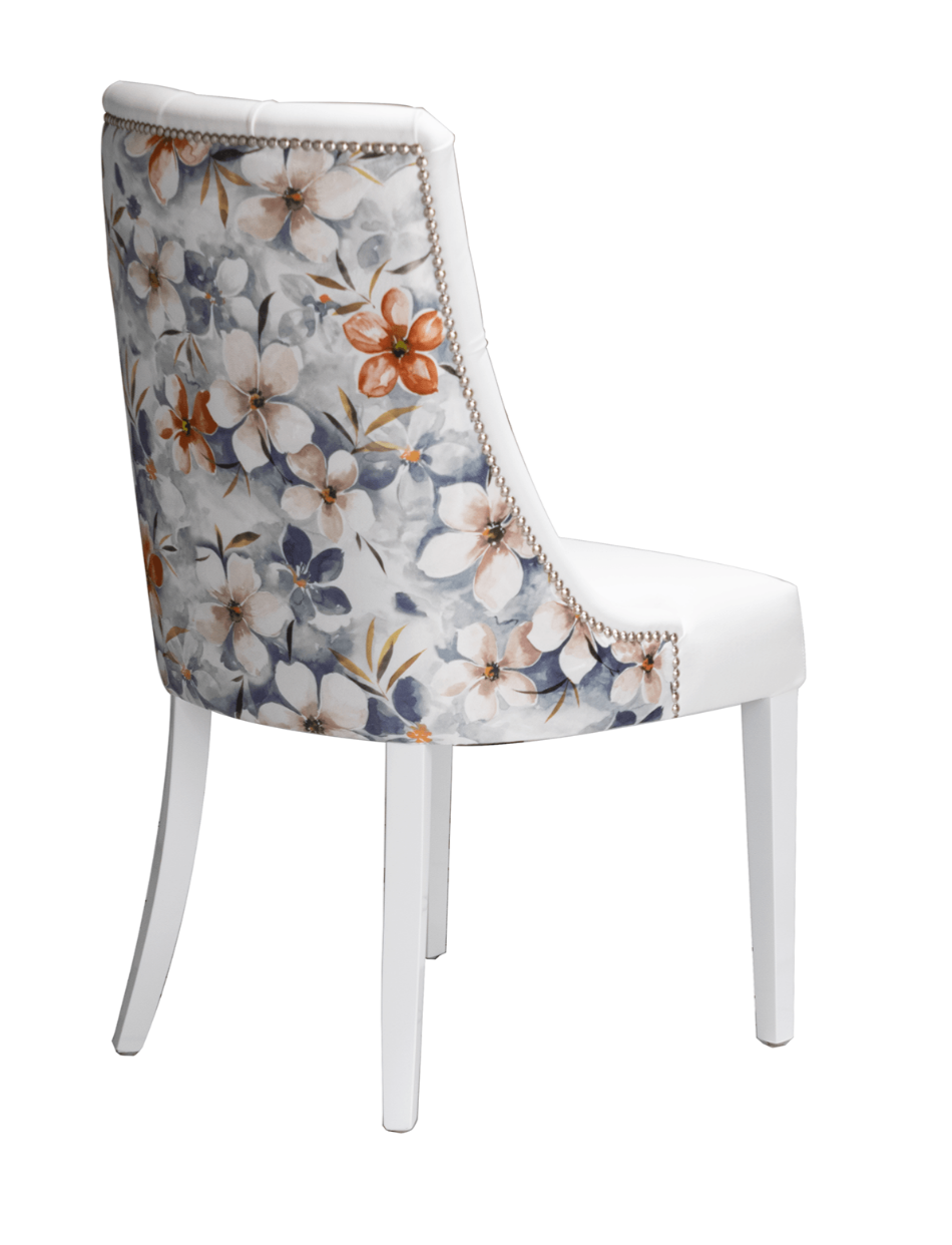 deep button dining chairs with studs and floral fabric backs