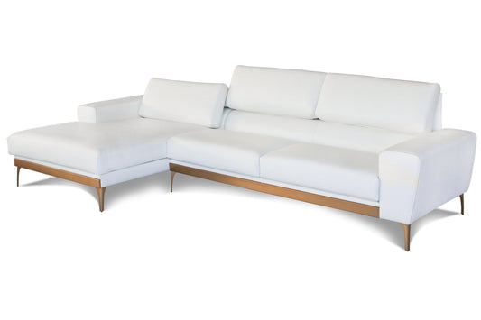 White leather L-shape couch with gold brass detailing