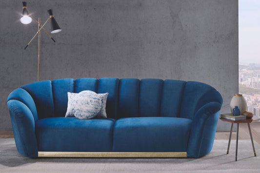Blue velvet 2 seater sofa with gold brass accents. 