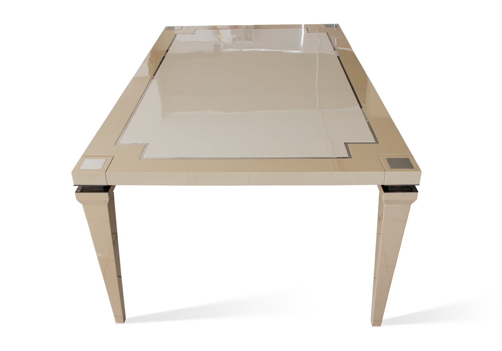 Luxury dining table in gloss ivory wood with silver accents.