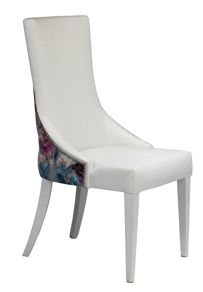 dinign chair in faux white leather with floral back.