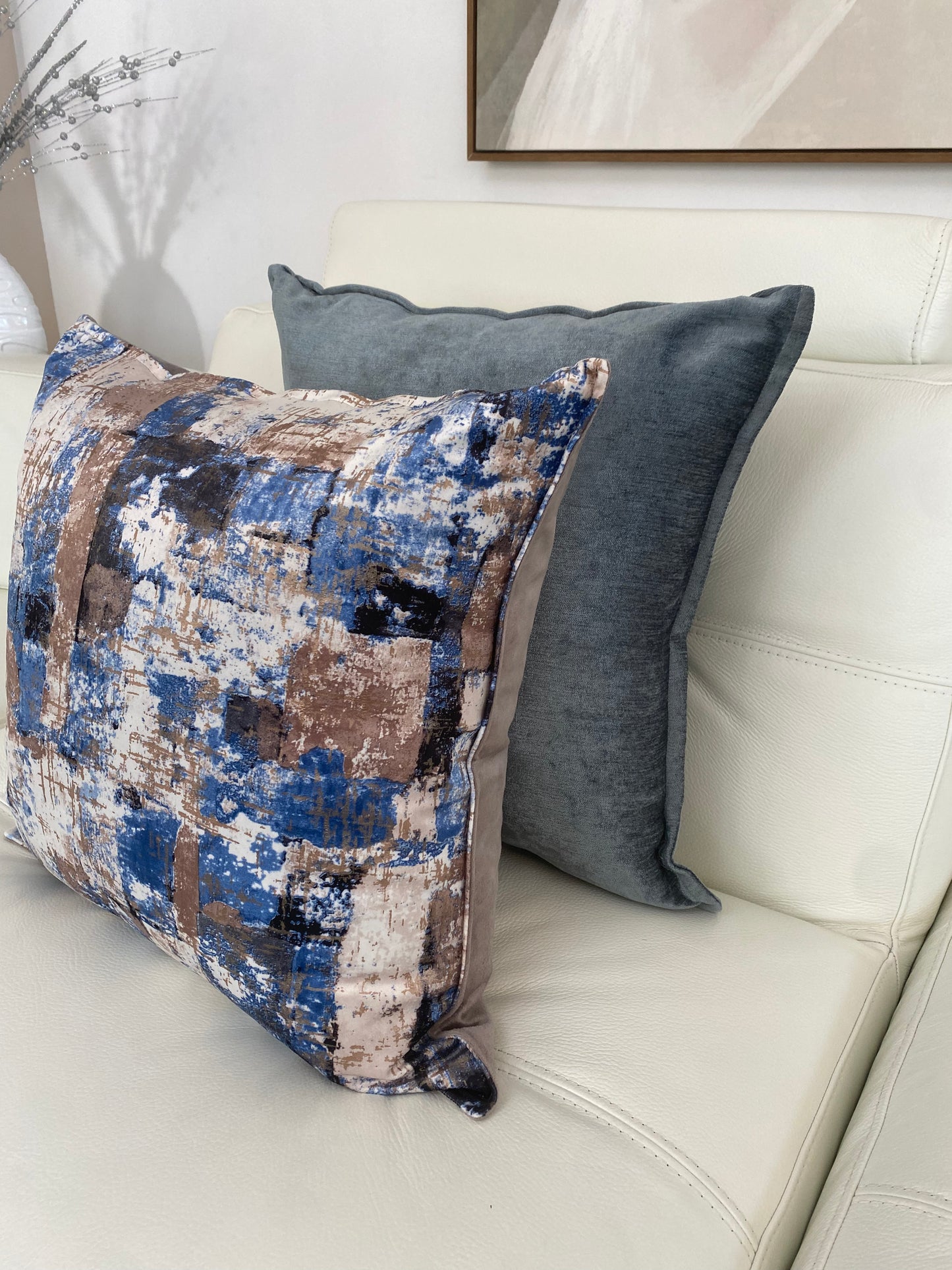 velvet scatter cushion in a taupe and blue colour