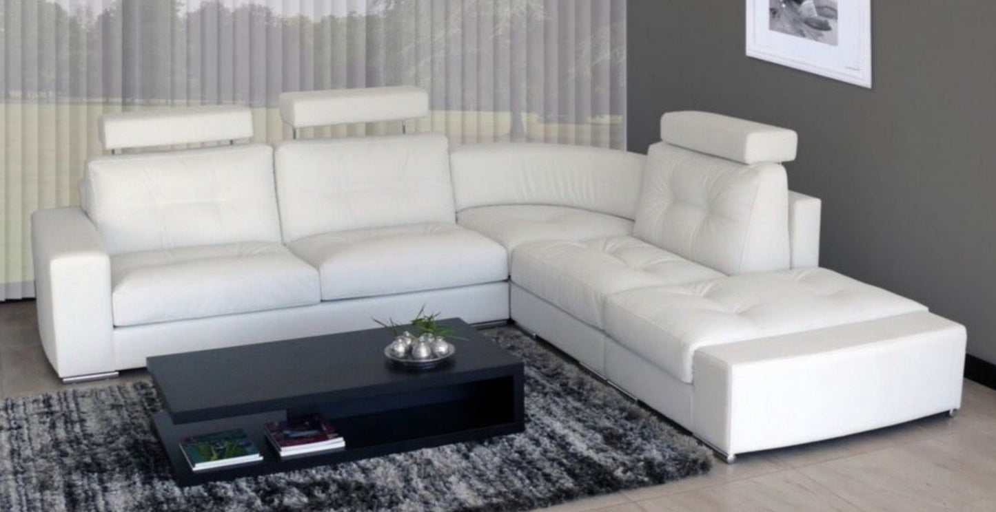 Corner couch win white leather uppers with adjustable headrests.